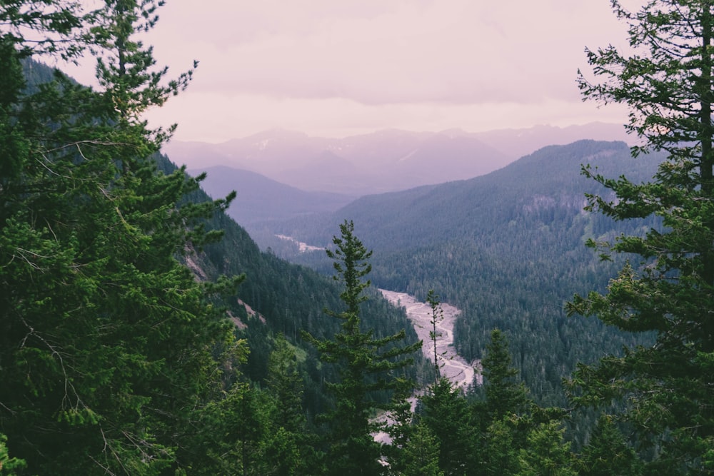 mountain rage view under cloudy sky during daytime