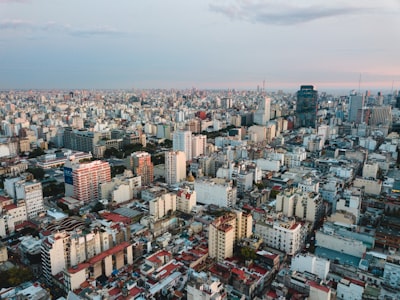 aerial view of city under cloudy sky during daytime