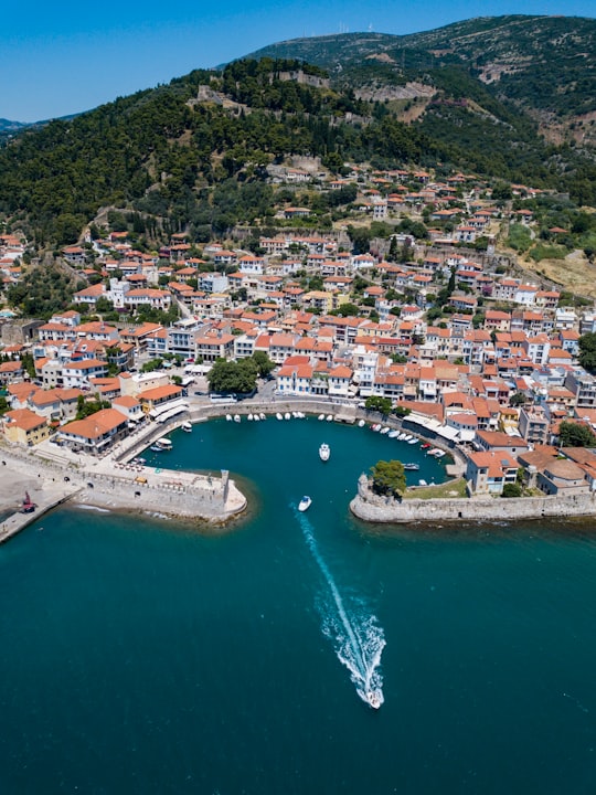 motorboat moving away from land formation in Nafpaktos Greece