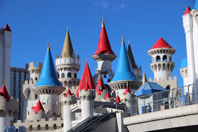 A playful coloring page showing a castle with children and mythical creatures ready to be colored.