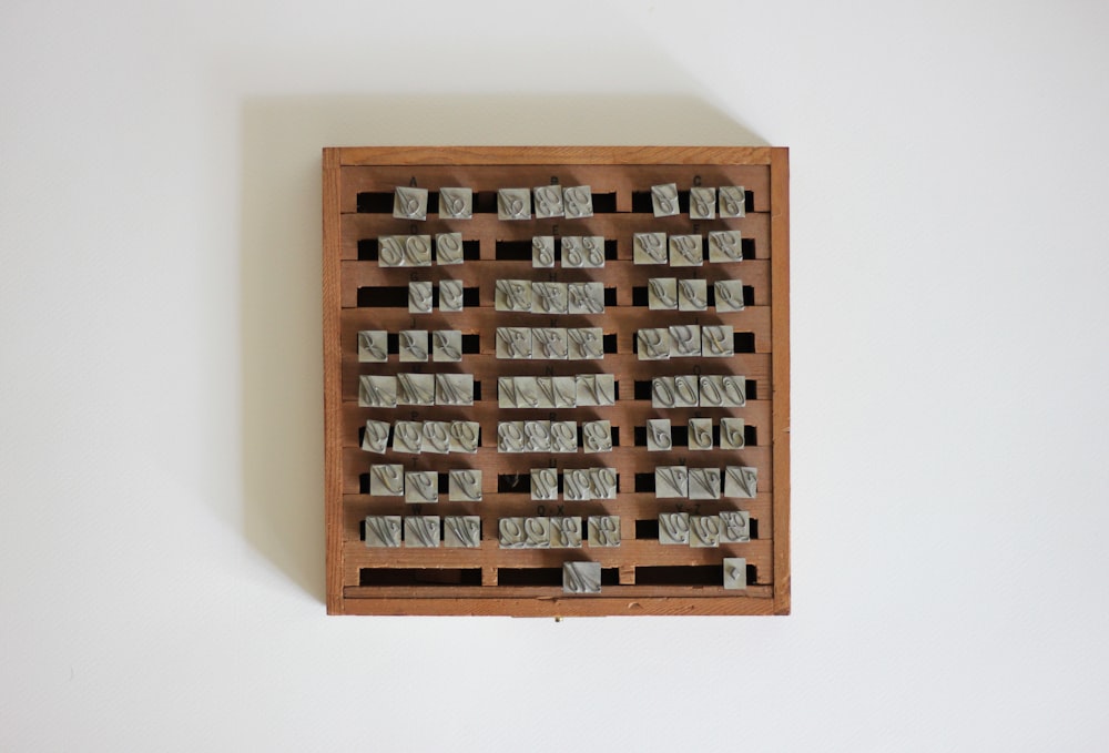 a wooden box filled with lots of small objects