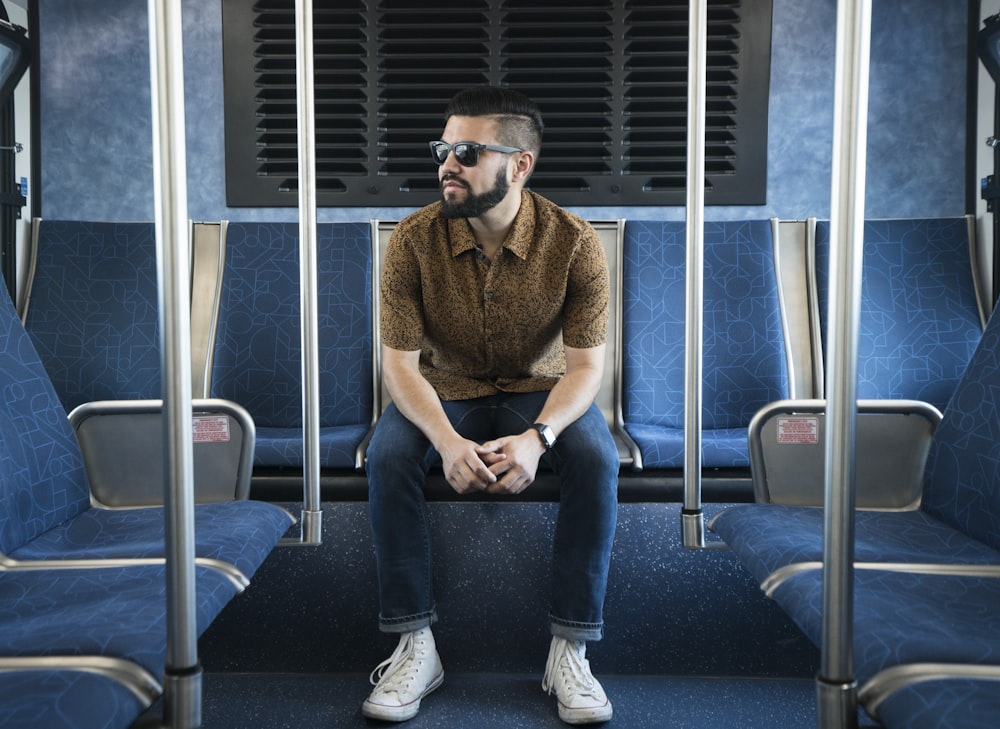 man sitting on gang chair