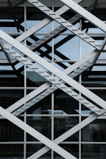 a close up of a metal structure with a sky in the background