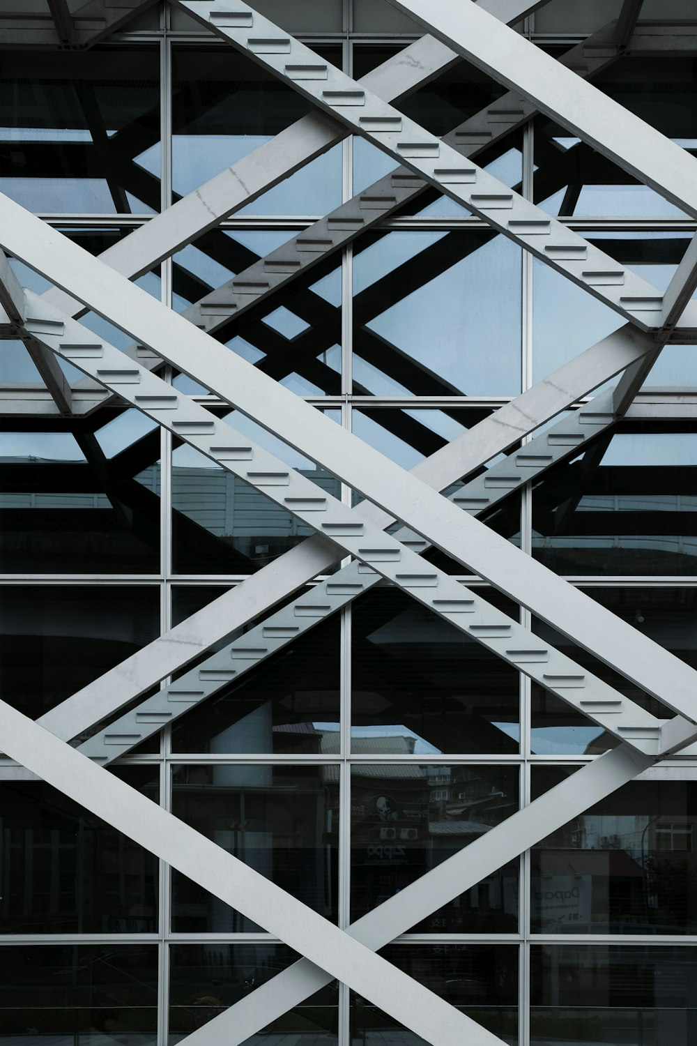 a close up of a metal structure with a sky in the background