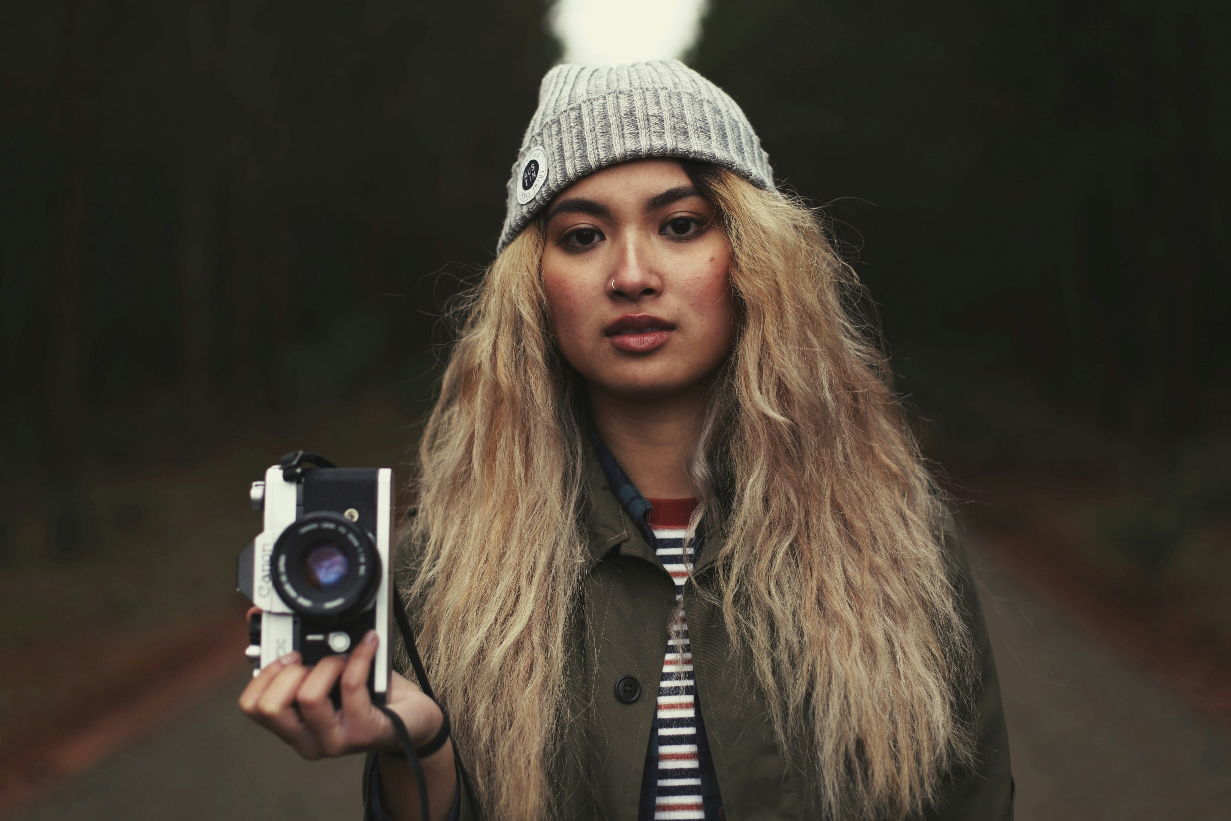 woman carrying camera