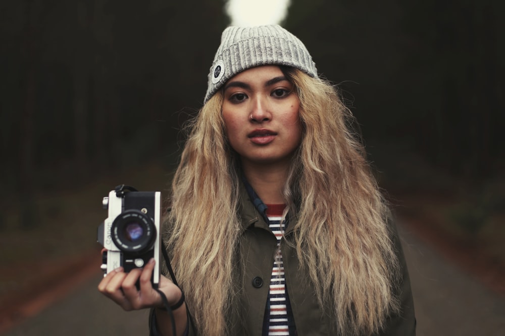 woman carrying camera