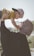 woman holding boy during daytime