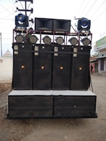 A close-up of a sound system setup at an outdoor concert.
