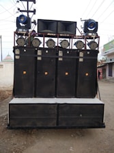 A sound system with speakers and microphones arranged for a live performance.