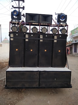 Professional sound system setup with speakers and mixing console at an event.