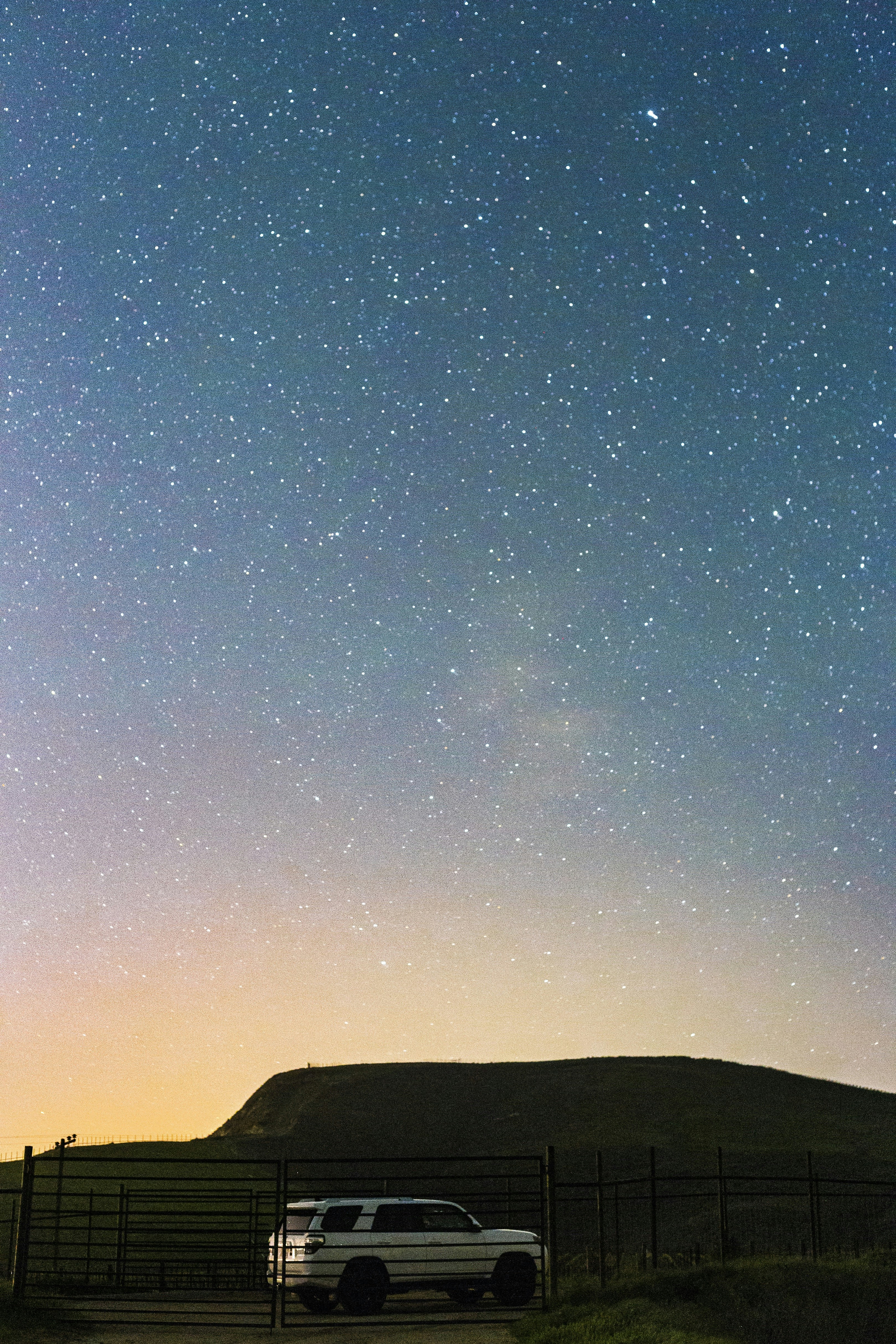 white SUV under star field