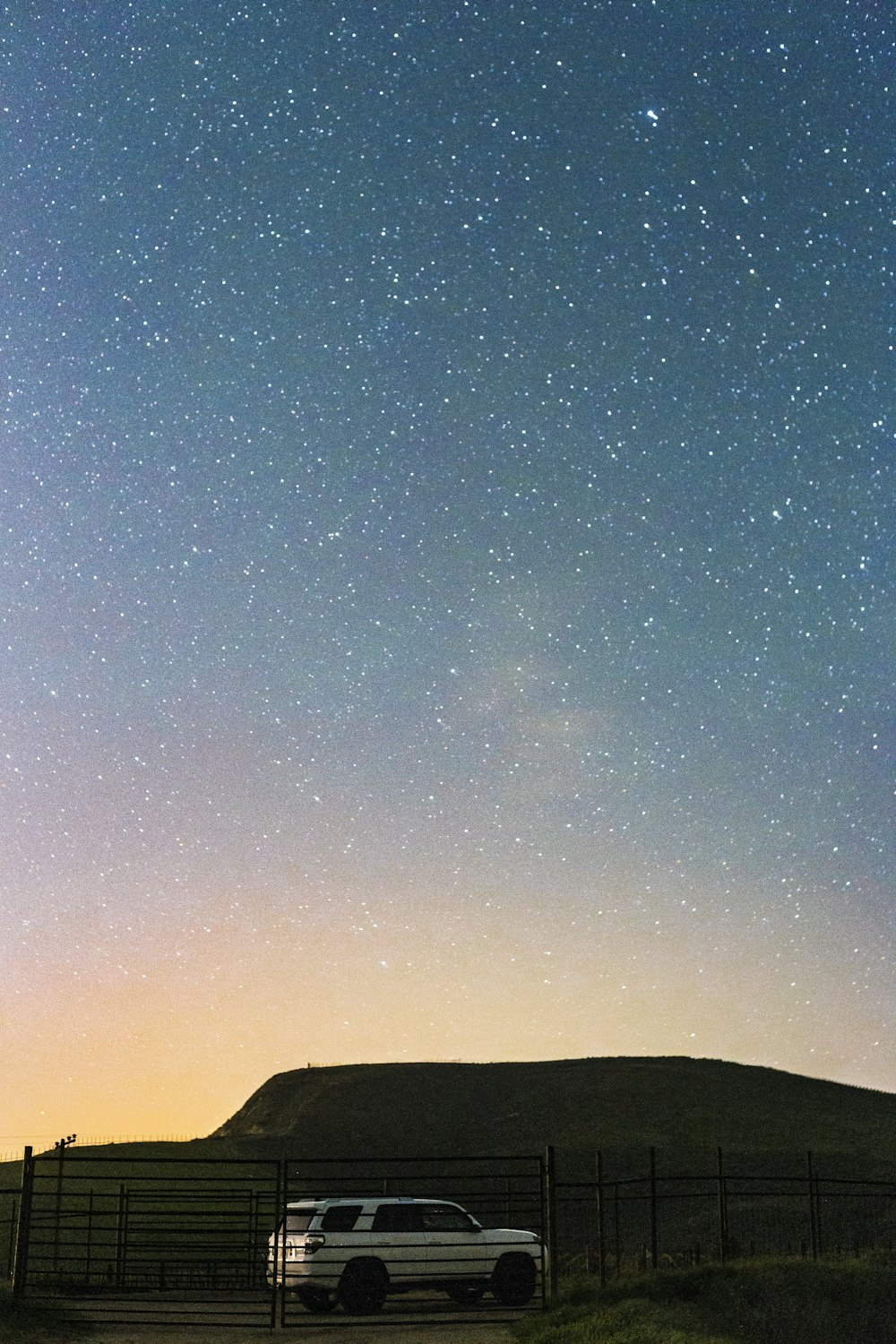 white SUV under star field