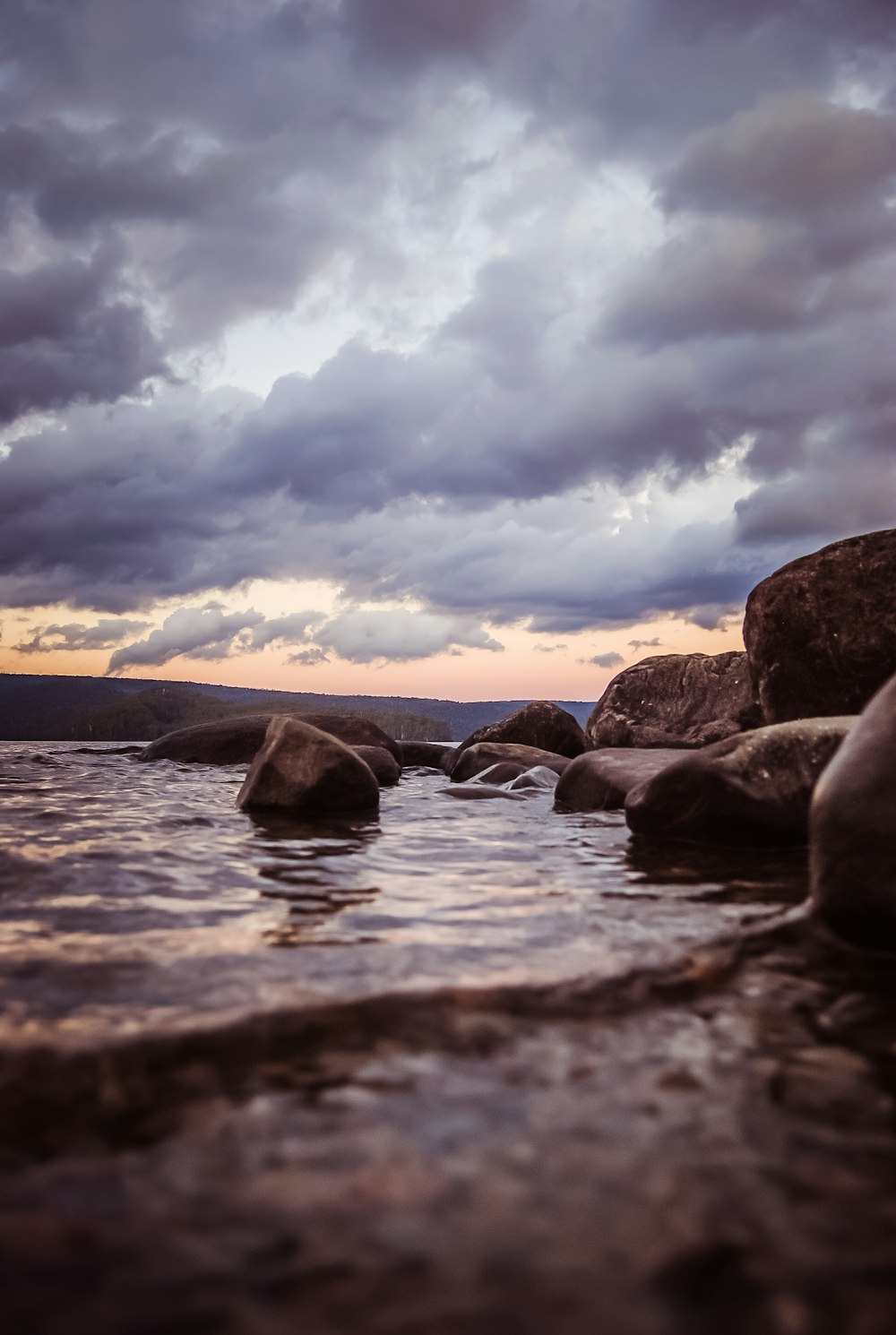 brown stone on body of water