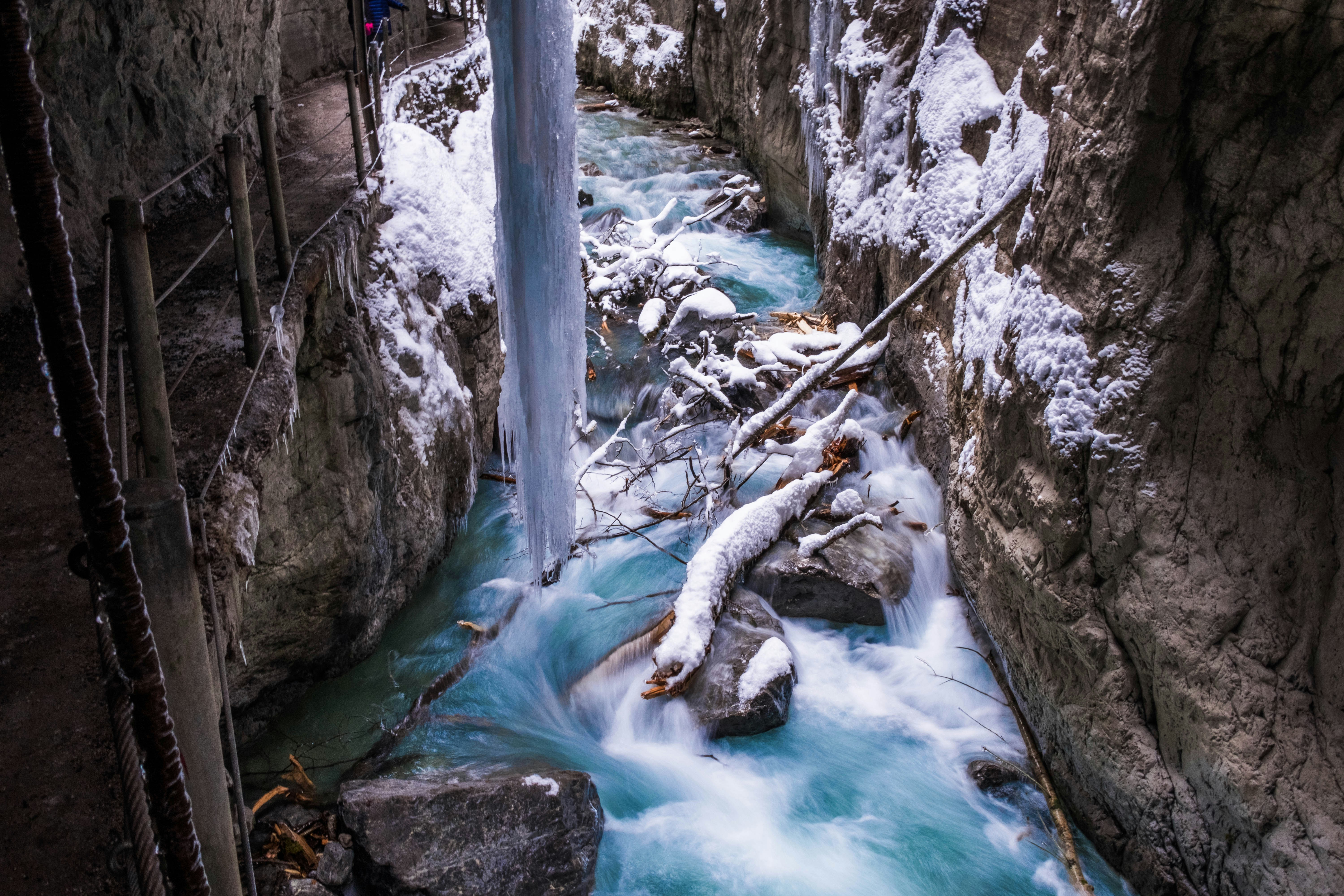 river near rock cliff