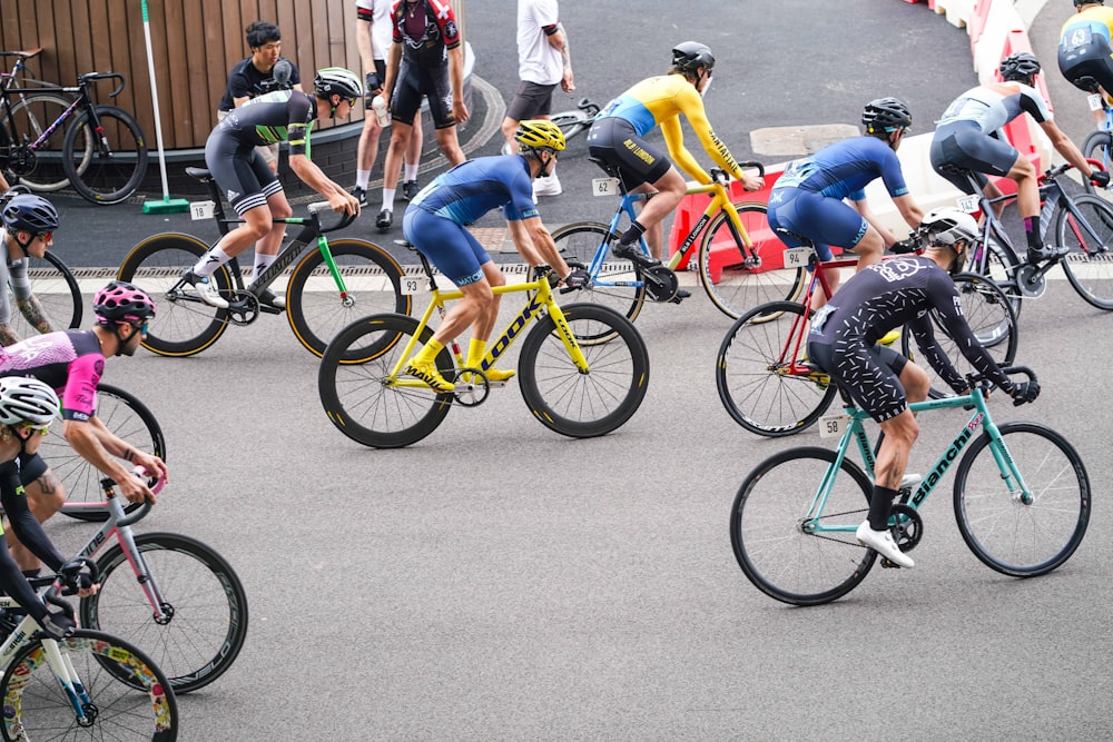 people riding on bicycle cycling at daytime