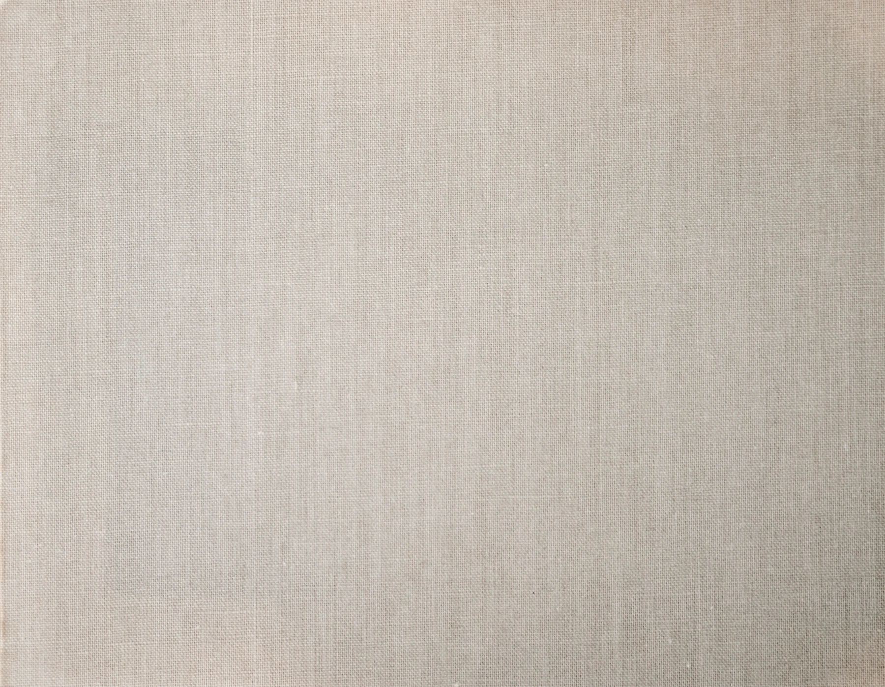 Close-up of softly folded natural-toned fabric