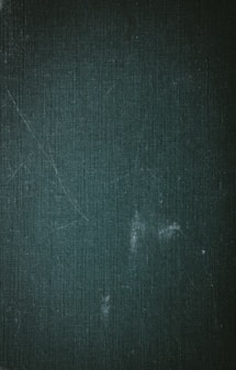 a black and white photo of a blackboard