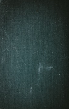 a black and white photo of a blackboard