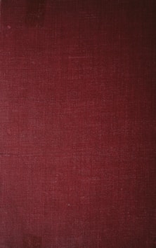 a close up of a red book cover