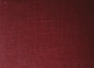 a close up of a red book cover