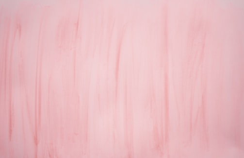 A soft blush background with elegant platinum accents.