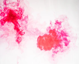 Close-up of vibrant water-based ink being applied on a flexographic printing press.