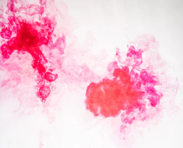 Close-up of vibrant water-based ink being applied on a flexographic printing press.