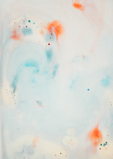 an abstract painting with orange and blue colors