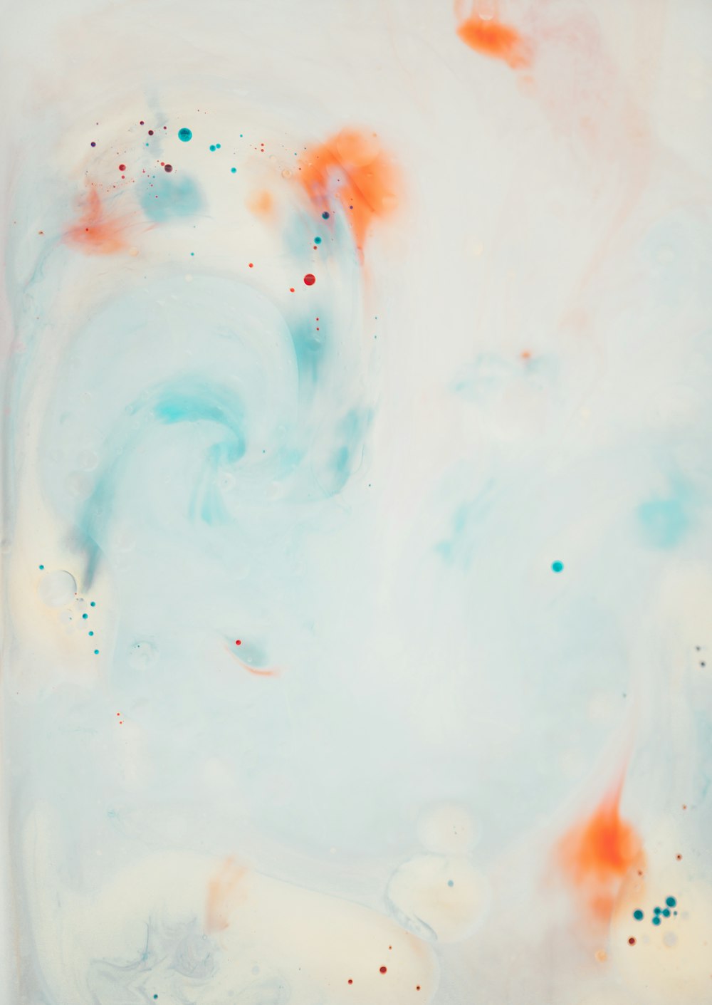 an abstract painting with orange and blue colors