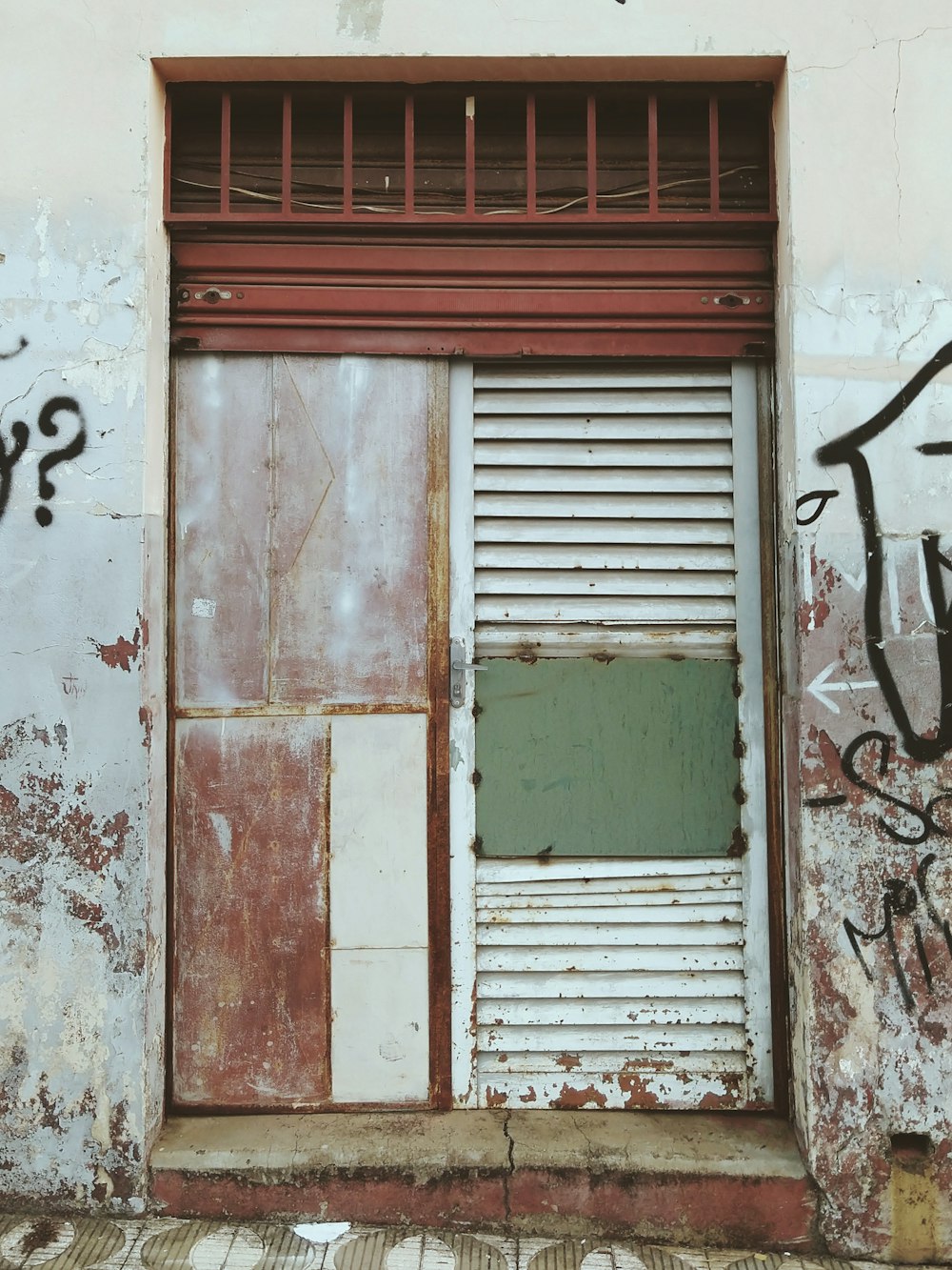 gray and red metal door