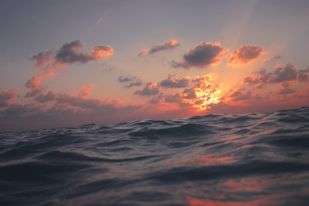 body of water under cloudy sky scenery