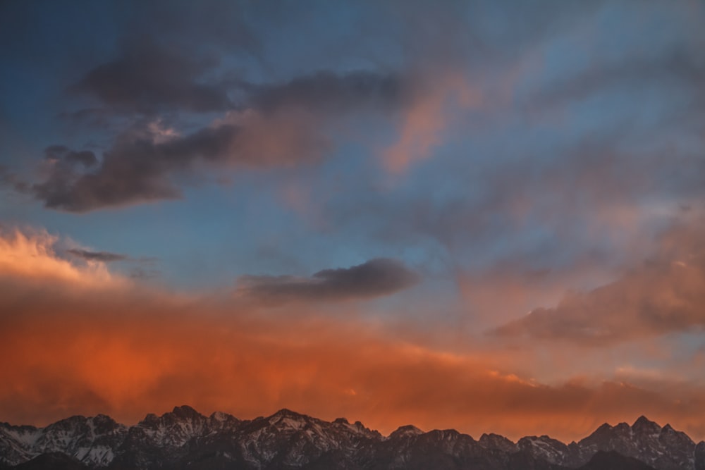gray mountain range during sunset