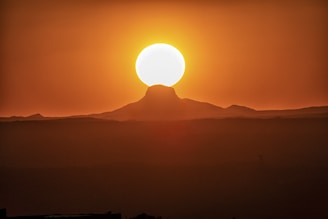 silhouette of mountain range during sunrise