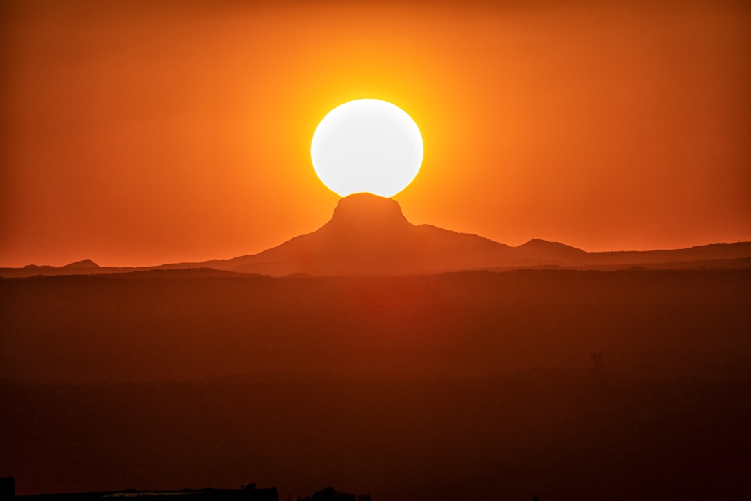 silhouette of mountain range during sunrise