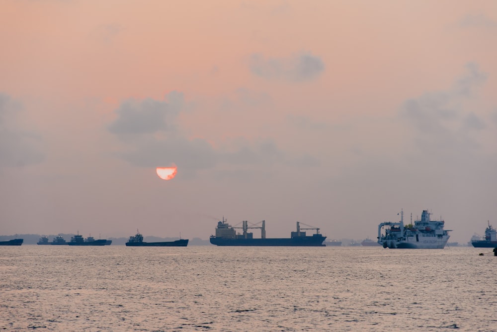 ships at the ocean during golden hour