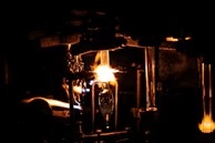 A nighttime workshop scene where a character designer brings their vision to life using vividforge supplies under purple neon lighting.