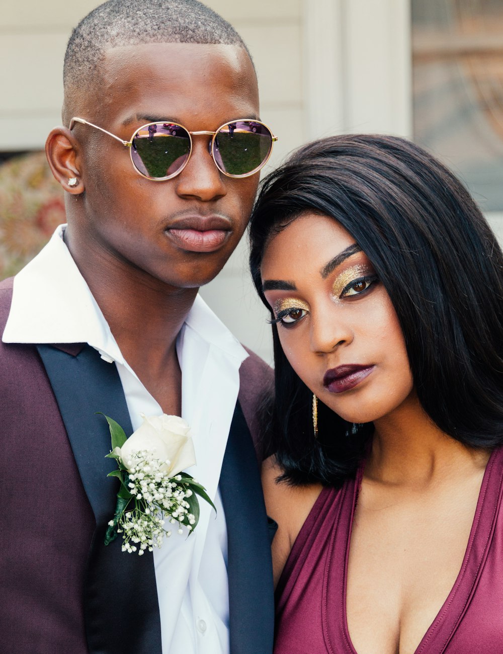 man and woman wearing formal suits