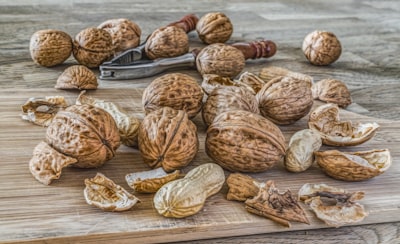 peanut lot on brown wooden area pecan teams background