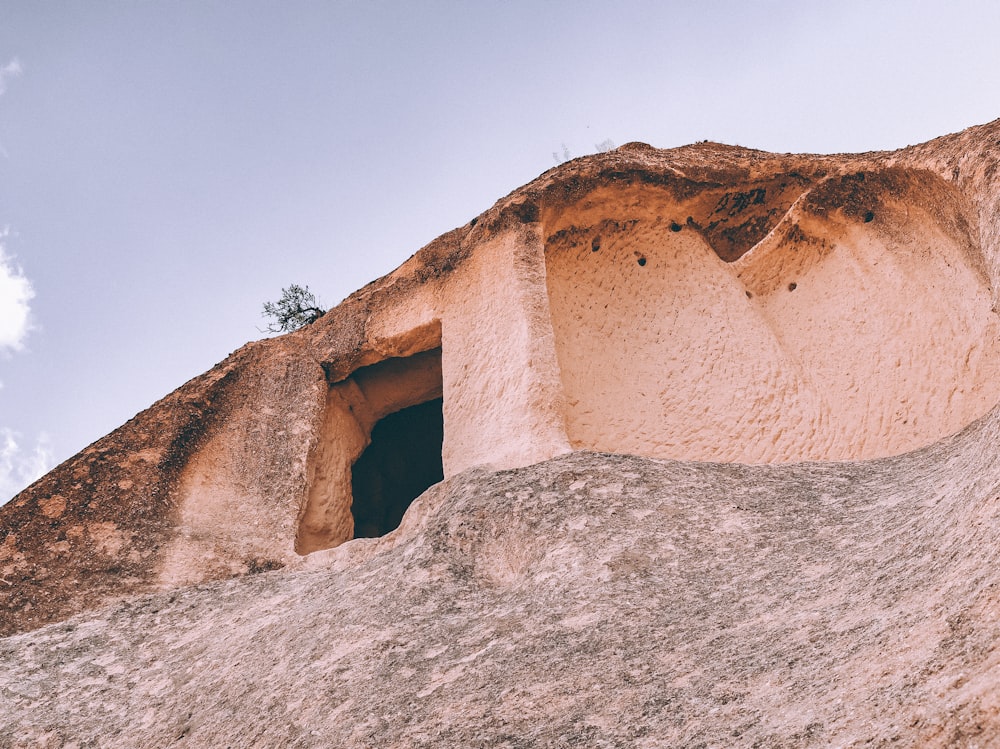 low angle photography brown cave