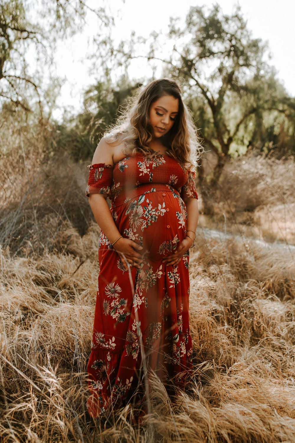 pregnant woman walking on grass