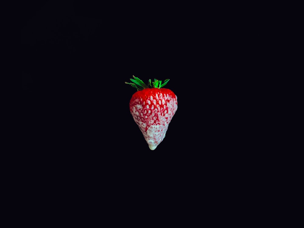 strawberry on black surface