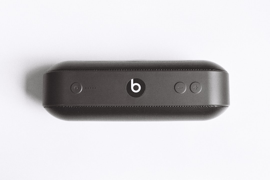 black Beats by Dr Dre beatspill + on white surface