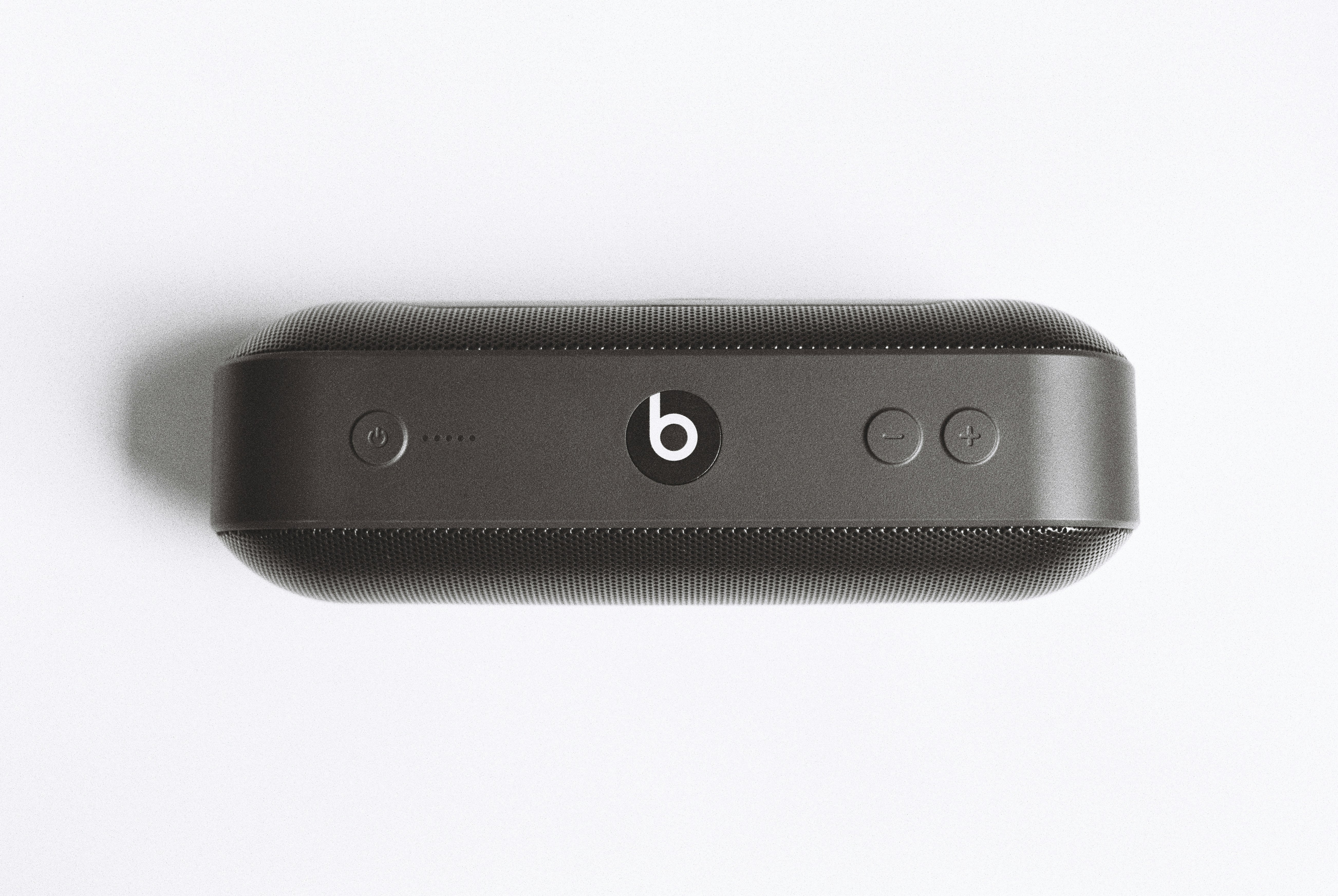 black Beats by Dr Dre beatspill + on white surface