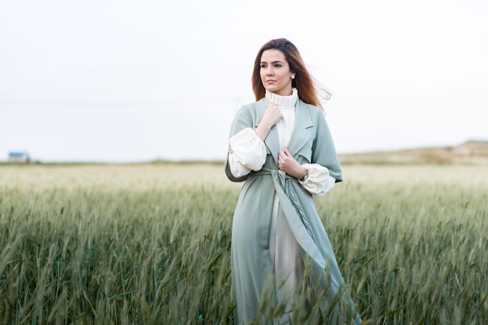 woman standing on grain fields