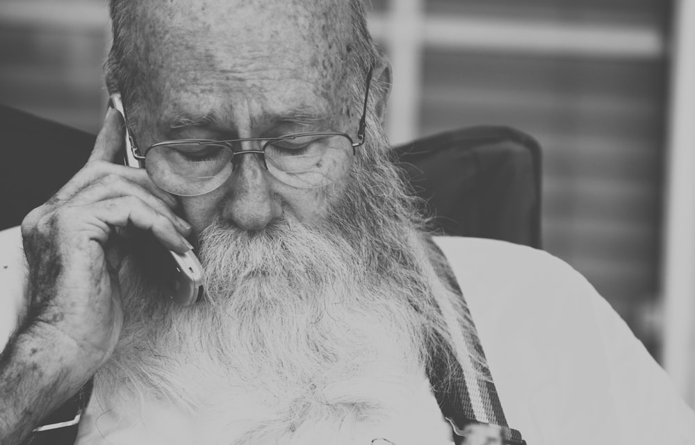 man putting phone to his ear