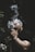 man smoking beside green leafed plants