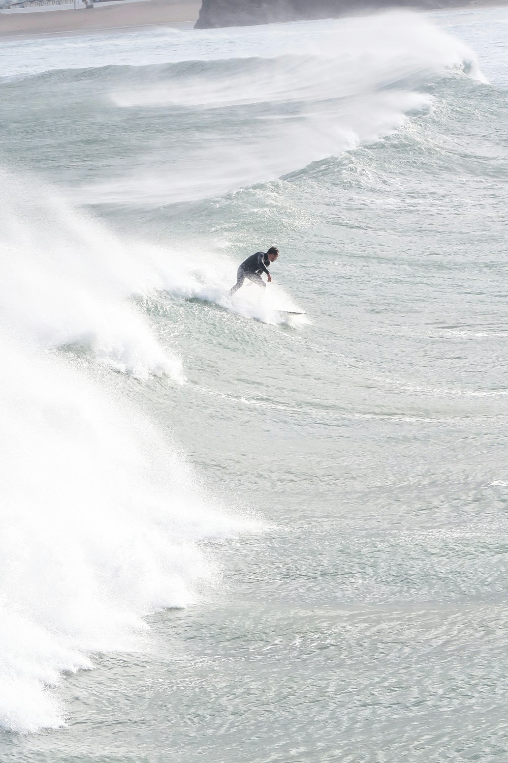 man surfboarding on waves