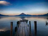 dock near water with cone mountain