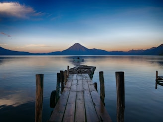 dock near water with cone mountain