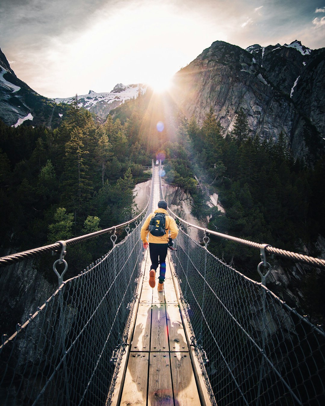 We were at this beautiful brige in murren , in the bernese Oberlan in switzerland with some friend, when i tell my friend to run like if he would catch the last ray.